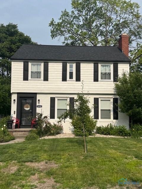 3152 Aldringham Rd, Toledo, OH 43606 - colonial home featuring a chimney and a front lawn
