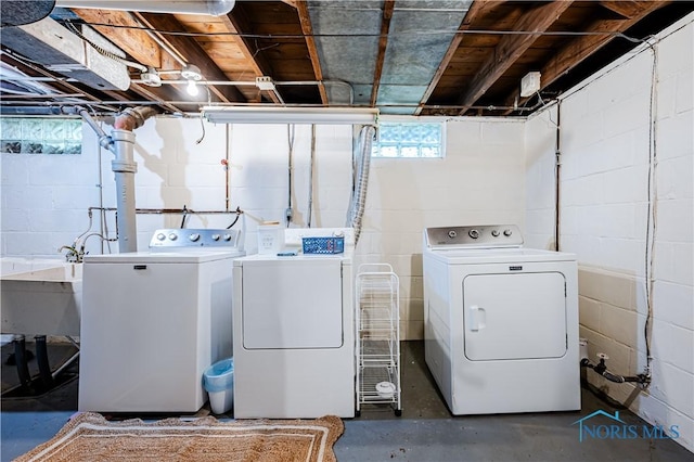 3714 Kershaw Ave, Toledo, OH 43613 - laundry room featuring washing machine and clothes dryer, healthy amount of natural light, and concrete block wall