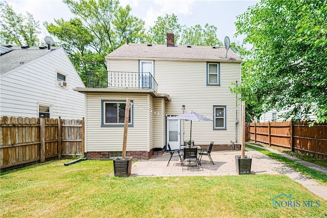 3714 Kershaw Ave, Toledo, OH 43613 - back of house featuring a fenced backyard, a patio area, a balcony, and a chimney
