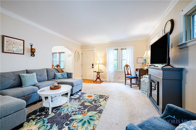 3714 Kershaw Ave, Toledo, OH 43613 - living area featuring ornamental molding, arched walkways, and light carpet