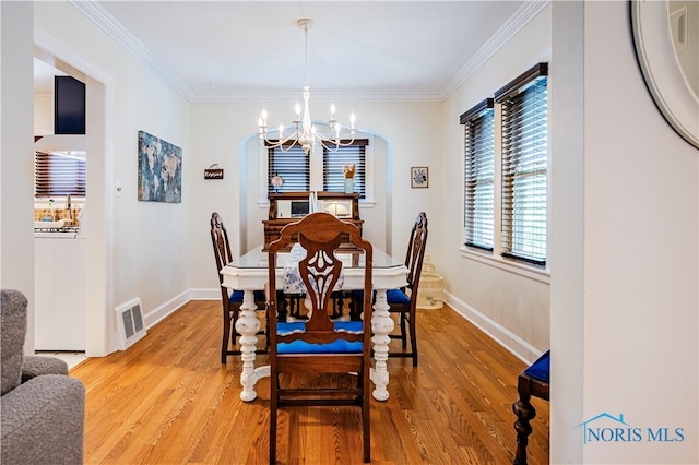 3714 Kershaw Ave, Toledo, OH 43613 - dining area with a chandelier, light wood-style flooring, and crown molding