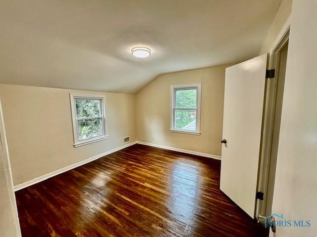 3748 Orono Dr, Toledo, OH 43614 - additional living space with lofted ceiling, plenty of natural light, and wood finished floors