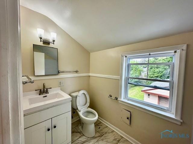 3748 Orono Dr, Toledo, OH 43614 - half bath featuring lofted ceiling, marble look tile flooring, and vanity