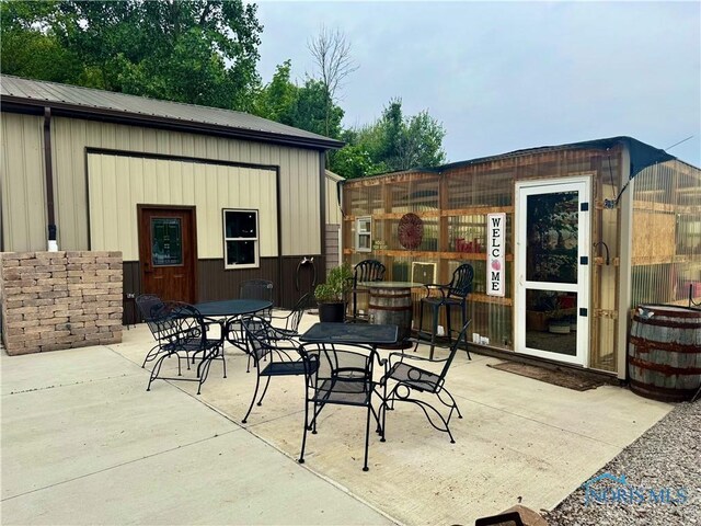 3391 Rd 144, Antwerp, OH 45813 - view of patio with outdoor dining area and an outbuilding