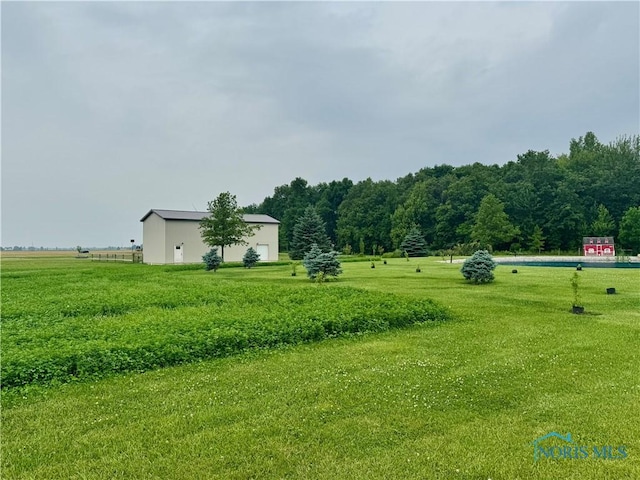 3391 Rd 144, Antwerp, OH 45813 - view of green lawn featuring a rural view and an outbuilding
