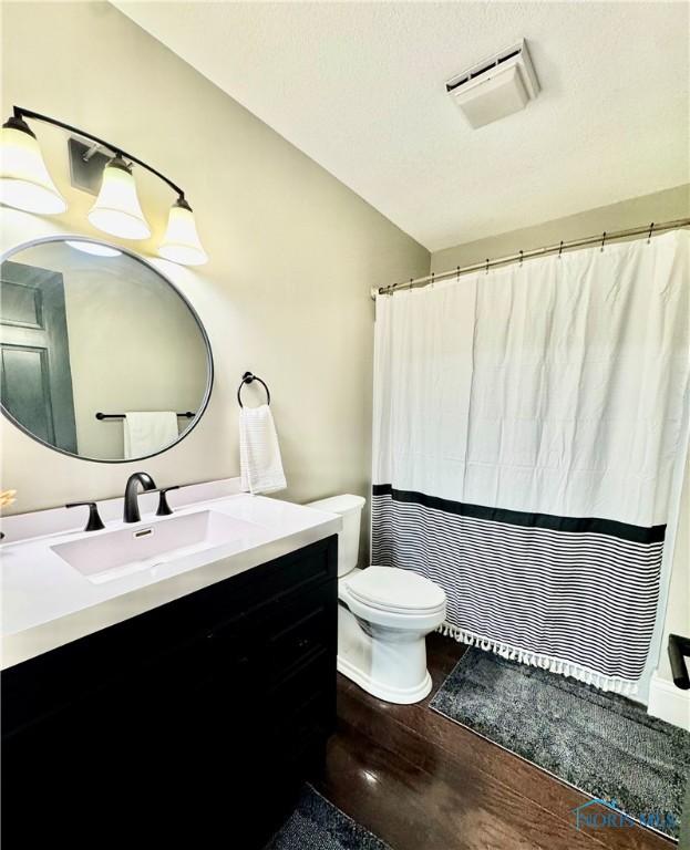 3391 Rd 144, Antwerp, OH 45813 - bathroom featuring vanity, wood finished floors, and curtained shower