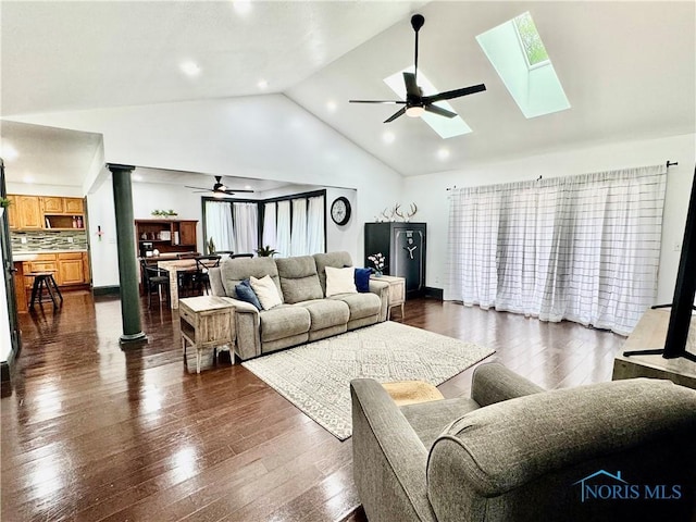 3391 Rd 144, Antwerp, OH 45813 - living area with a ceiling fan, a skylight, dark wood-style floors, high vaulted ceiling, and ornate columns