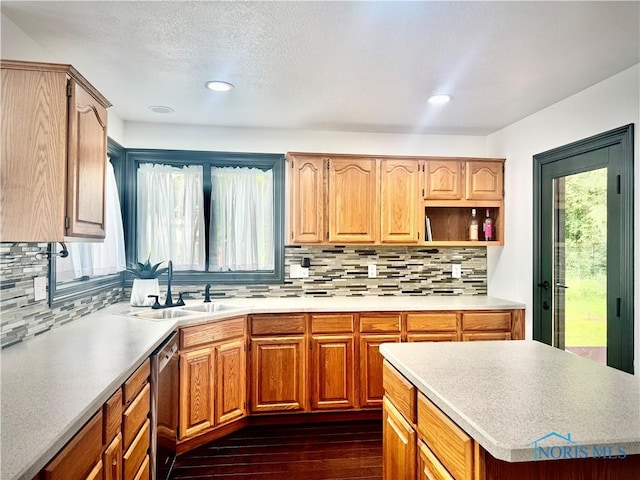 3391 Rd 144, Antwerp, OH 45813 - kitchen featuring stainless steel dishwasher, dark wood finished floors, tasteful backsplash, recessed lighting, and light countertops
