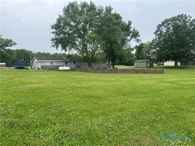 6432 State Route 576, Bryan, OH 43506 - view of yard featuring a trampoline