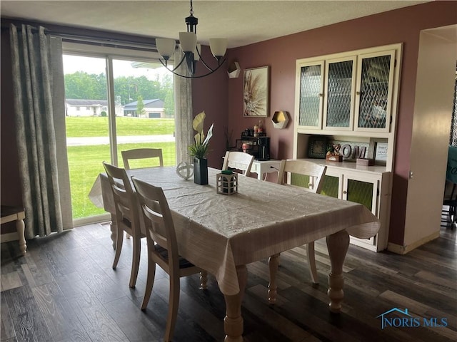 6432 State Route 576, Bryan, OH 43506 - dining room with a chandelier and dark wood-type flooring