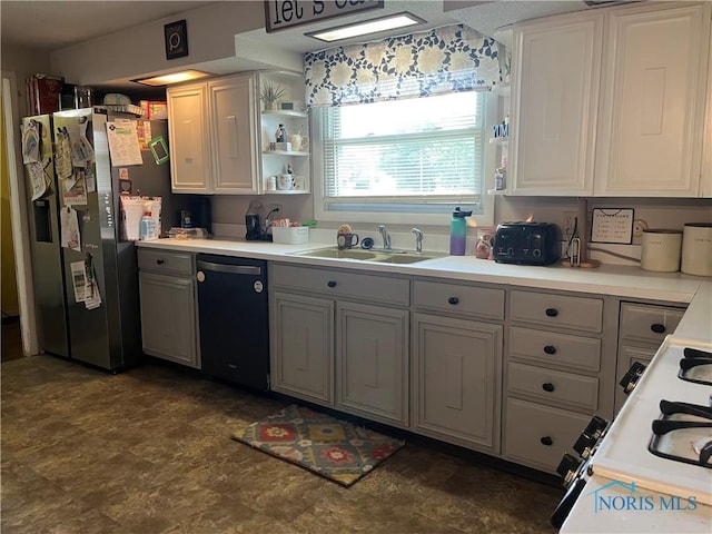 6432 State Route 576, Bryan, OH 43506 - kitchen featuring dishwasher, stainless steel fridge, light countertops, stone finish flooring, and gray cabinetry
