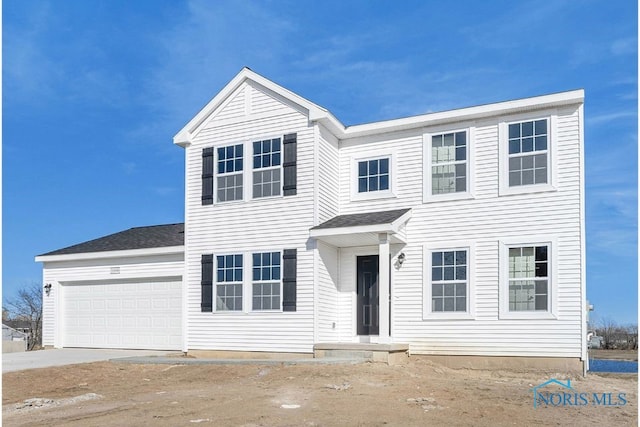 1113 Clairmont Ave, Napoleon, OH 43545 - view of front of house with a garage and driveway