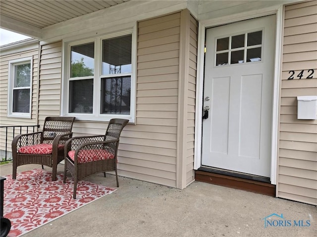 2421 106th Rd, Toledo, OH 43611 - doorway to property featuring covered porch