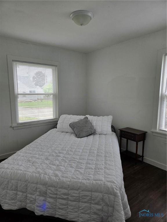 2421 106th Rd, Toledo, OH 43611 - bedroom featuring wood finished floors and multiple windows
