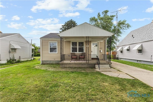 2421 106th Rd, Toledo, OH 43611 - view of front of house with a porch and a front lawn