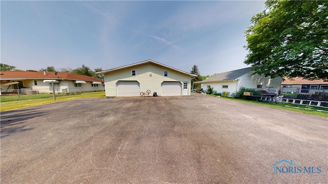 628 W Maple St, Clyde, OH 43410 - view of front of home with a garage and an outdoor structure