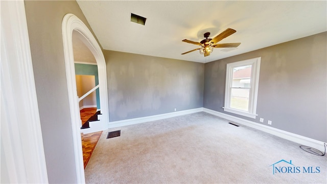 628 W Maple St, Clyde, OH 43410 - carpeted spare room with ceiling fan and stairs