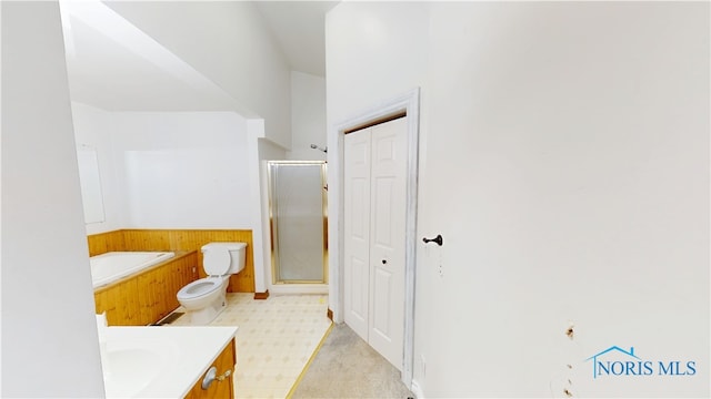 628 W Maple St, Clyde, OH 43410 - bathroom featuring vanity, a stall shower, a closet, and a bath