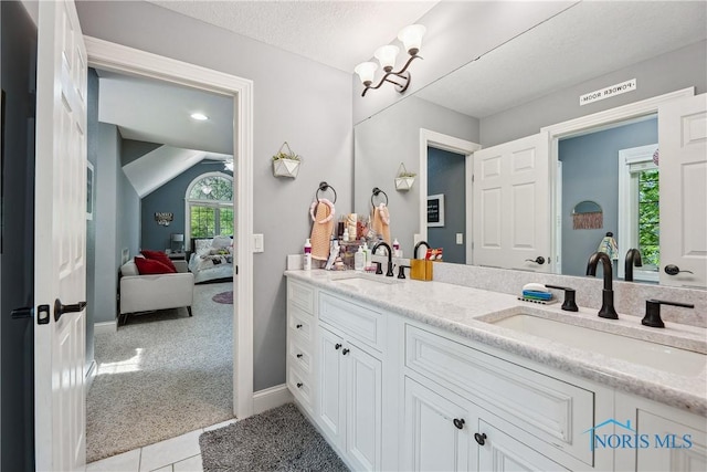 4811 Yosemite Pkwy, Sylvania, OH 43560 - ensuite bathroom with double vanity and tile patterned floors