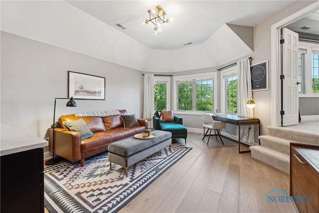 4811 Yosemite Pkwy, Sylvania, OH 43560 - living area featuring light wood finished floors and a chandelier