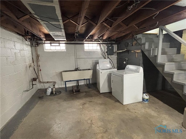 2914 118th St, Toledo, OH 43611 - below grade area featuring washer and dryer, electric panel, and stairway