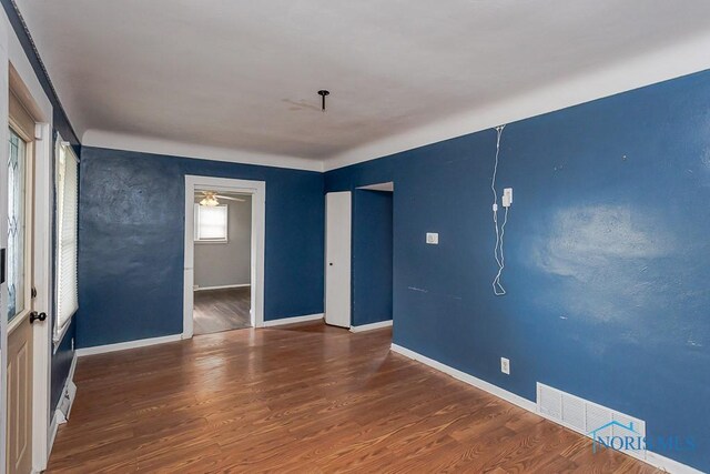 1040 Richland St, Maumee, OH 43537 - empty room with wood finished floors and a ceiling fan