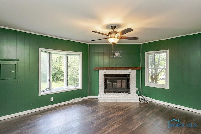 1040 Richland St, Maumee, OH 43537 - unfurnished living room featuring ceiling fan, ornamental molding, wood finished floors, a fireplace, and electric panel