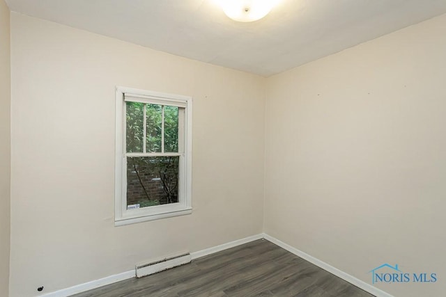 1040 Richland St, Maumee, OH 43537 - empty room featuring a baseboard radiator and dark wood finished floors