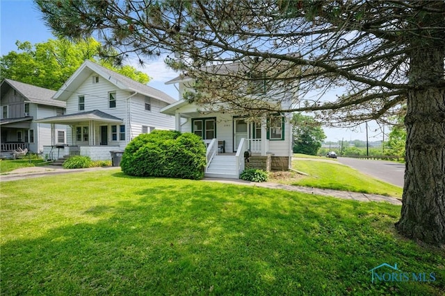 3504 Willys Pkwy, Toledo, OH 43612 - view of front facade featuring a porch and a front yard