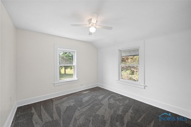 3504 Willys Pkwy, Toledo, OH 43612 - empty room with dark colored carpet, lofted ceiling, and ceiling fan