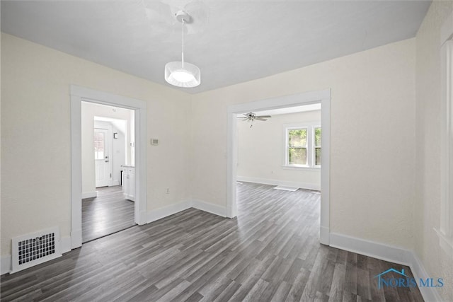 3504 Willys Pkwy, Toledo, OH 43612 - empty room with dark wood-style floors and a ceiling fan