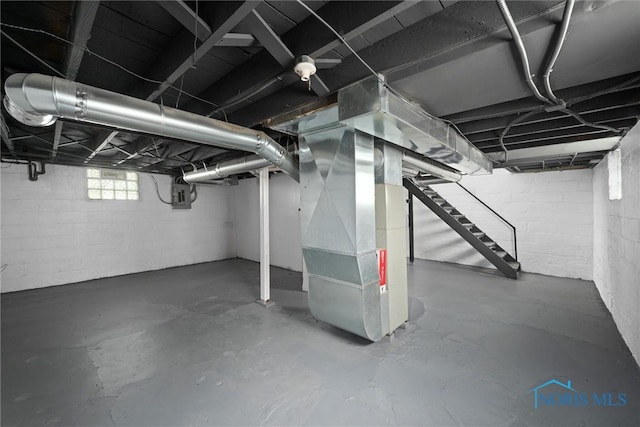 3504 Willys Pkwy, Toledo, OH 43612 - basement with electric panel, heating unit, and stairway