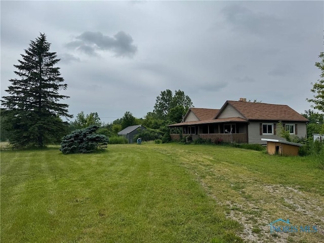 1447 US Highway 20, Edon, OH 43518 - view of grassy yard with a porch