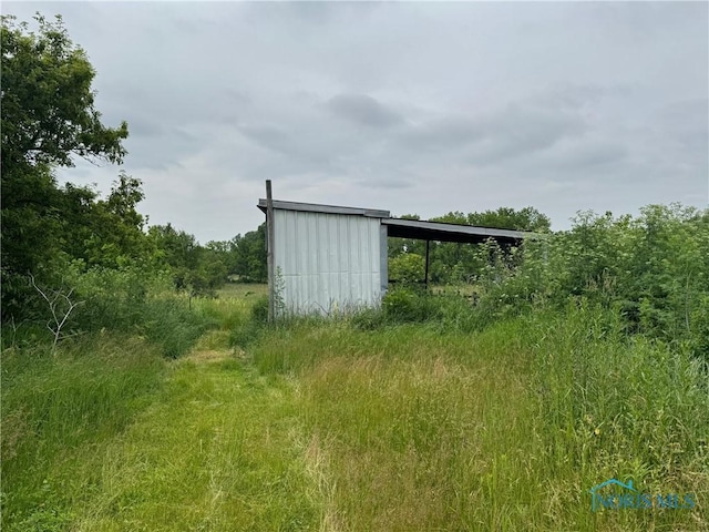 1447 US Highway 20, Edon, OH 43518 - view of pole building featuring a carport
