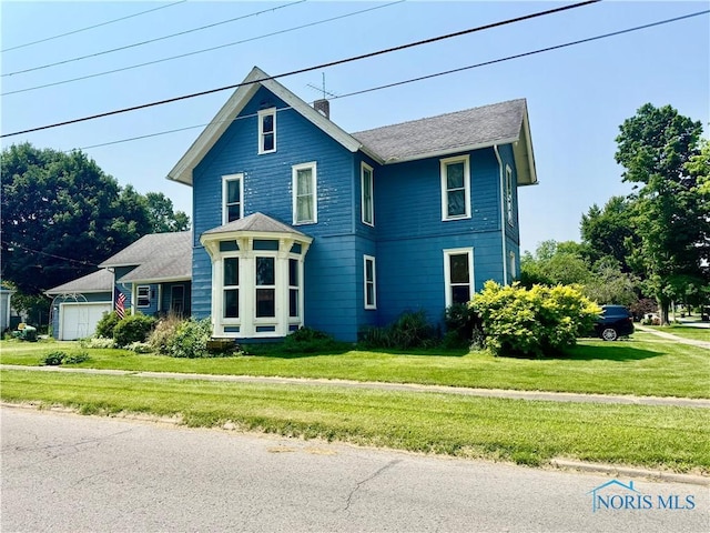 121 Columbus St, Hicksville, OH 43526 - view of front facade featuring a front yard