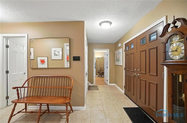4329 Woodbriar Dr, Toledo, OH 43623 - entrance foyer with a textured ceiling and light tile patterned floors