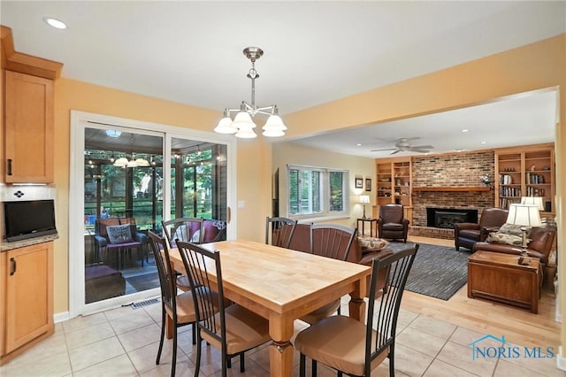 4329 Woodbriar Dr, Toledo, OH 43623 - dining area featuring light tile patterned flooring, a fireplace, a ceiling fan, recessed lighting, and built in features