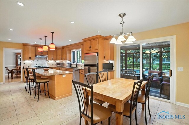 4329 Woodbriar Dr, Toledo, OH 43623 - dining room with light tile patterned flooring, recessed lighting, and a chandelier