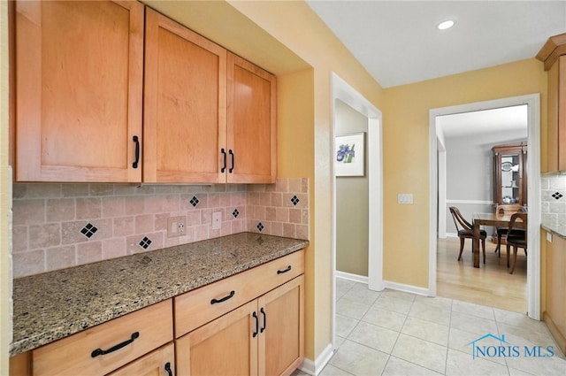 4329 Woodbriar Dr, Toledo, OH 43623 - kitchen with light stone counters, tasteful backsplash, light tile patterned floors, and recessed lighting