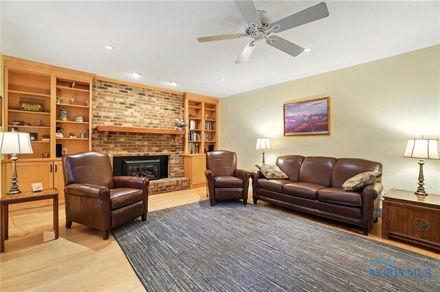 4329 Woodbriar Dr, Toledo, OH 43623 - living area featuring light wood finished floors, ceiling fan, a fireplace, recessed lighting, and built in features