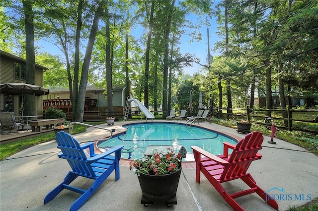 4329 Woodbriar Dr, Toledo, OH 43623 - view of swimming pool featuring a water slide and a patio area
