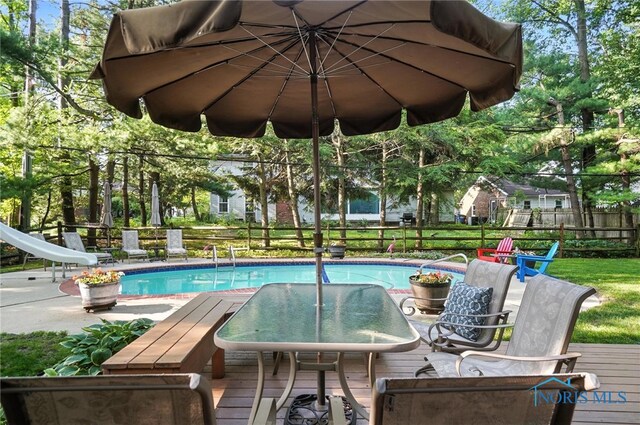 4329 Woodbriar Dr, Toledo, OH 43623 - outdoor pool with a water slide and outdoor dining area