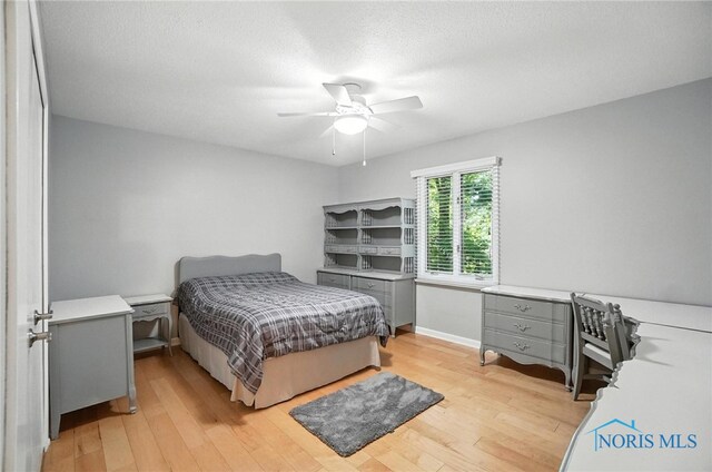 4329 Woodbriar Dr, Toledo, OH 43623 - bedroom featuring light wood-type flooring and ceiling fan