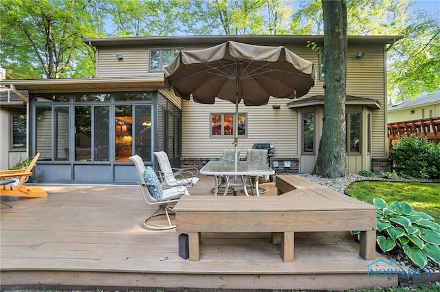 4329 Woodbriar Dr, Toledo, OH 43623 - rear view of house with a sunroom and a deck