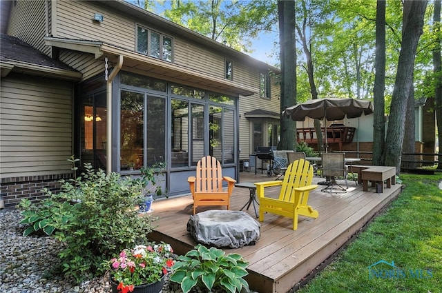 4329 Woodbriar Dr, Toledo, OH 43623 - wooden deck featuring a sunroom, outdoor dining area, and grilling area