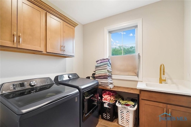 1635 Winterwood Ct, Bowling Green, OH 43402 - washroom with washing machine and clothes dryer and cabinet space
