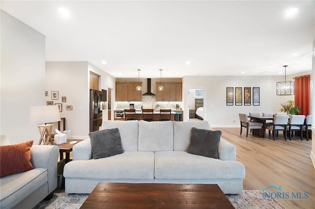 1635 Winterwood Ct, Bowling Green, OH 43402 - living area featuring light wood finished floors, recessed lighting, and a chandelier