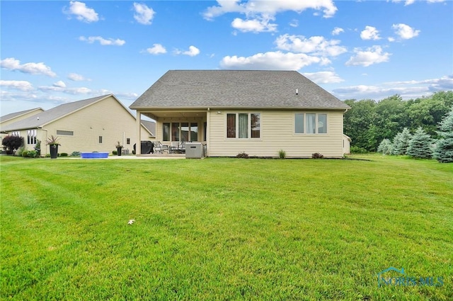 1635 Winterwood Ct, Bowling Green, OH 43402 - rear view of house with a patio area and a lawn