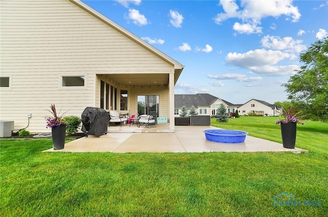 1635 Winterwood Ct, Bowling Green, OH 43402 - back of house with a patio area, a lawn, and an outdoor living space