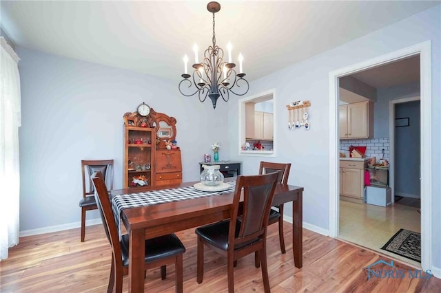 1932 Queenswood Dr Unit U5, Findlay, OH 45840 - dining space with a chandelier and light wood-style flooring